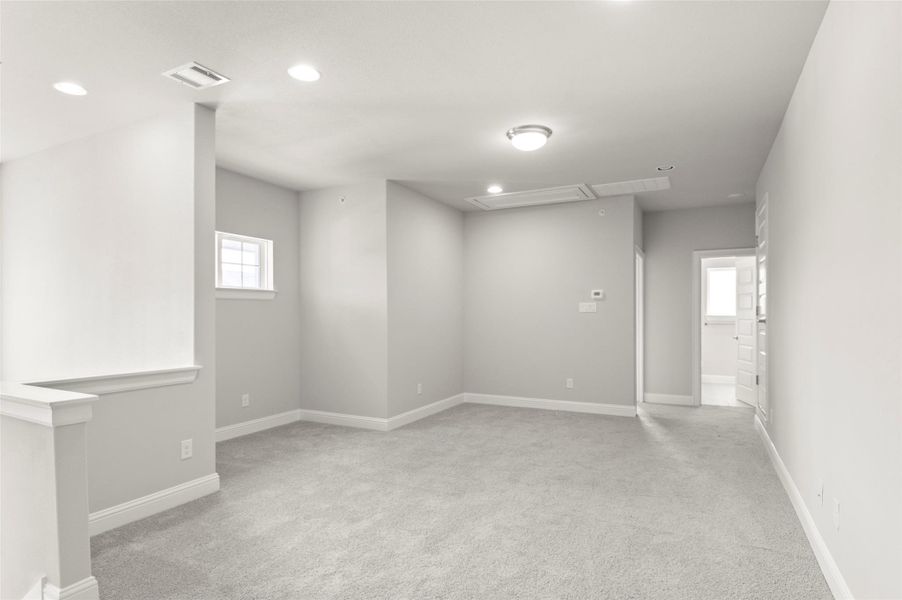Unfurnished room with attic access, carpet floors, and recessed lighting Unfurnished room with attic access, carpet floors, and recessed lighting