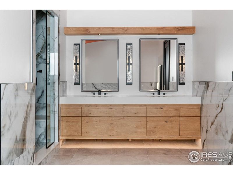 Primary bath vanity with custom oak cabinetry