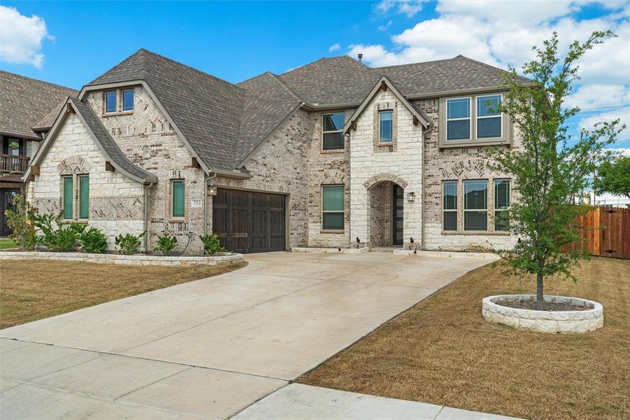 Front exterior of a new home in Fox Hollow, Forney, TX, highlighting curb appeal (Image 2).