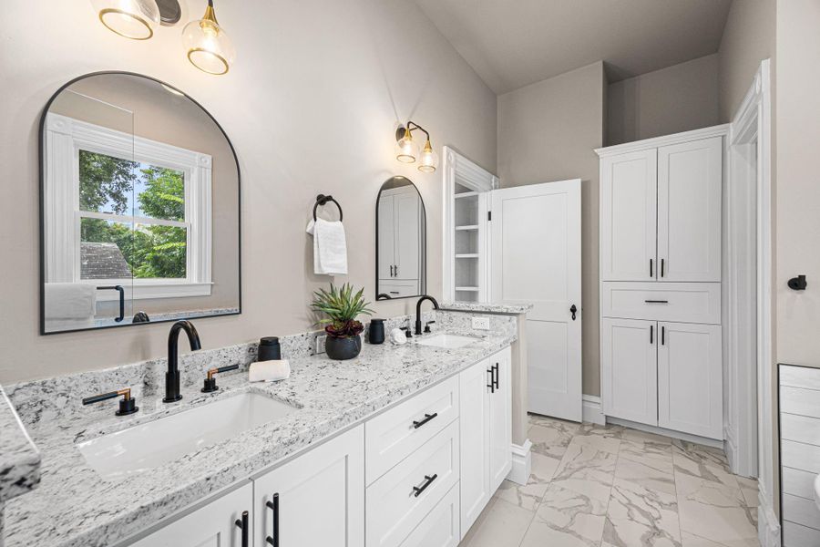 The primary bathroom offers granite countertops, a double vanity sink...and plenty of storage! The primary bathroom offers granite countertops, a double vanity sink...and plenty of storage!