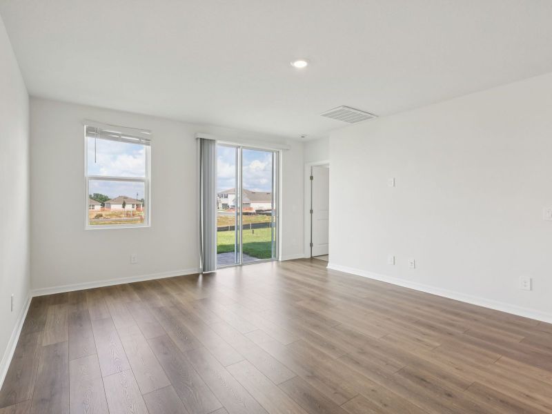 Spacious, unfurnished interior of a new home in The Reserve at Hammock Oaks - Classic Series, Lady Lake (Image 6).