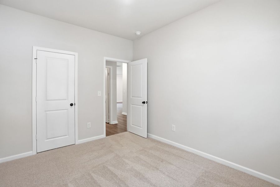 Representative unfurnished interior of a home built from the Loblolly Select N by McGuinn Homes in Broadway Lake, Anderson (Image 18). Representative unfurnished interior of a home built from the Loblolly Select N by McGuinn Homes in Broadway Lake, Anderson (Image 18).