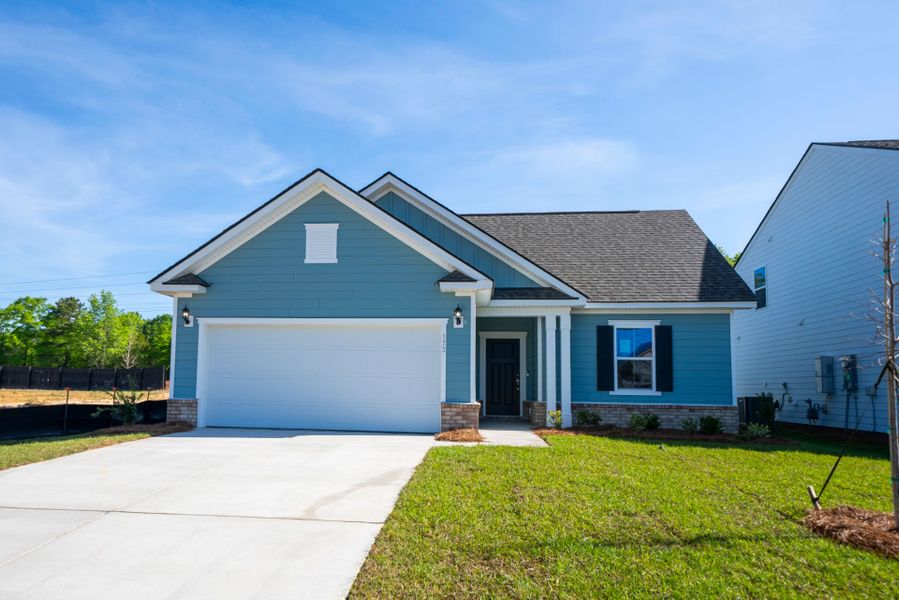 Front exterior of a new home in Monroe Preserve, Chapin, SC, highlighting curb appeal (Image 1). Front exterior of a new home in Monroe Preserve, Chapin, SC, highlighting curb appeal (Image 1).