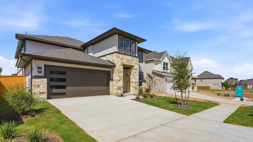 Front exterior of a new home in Oaks at San Gabriel, Georgetown, TX, highlighting curb appeal (Image 22).