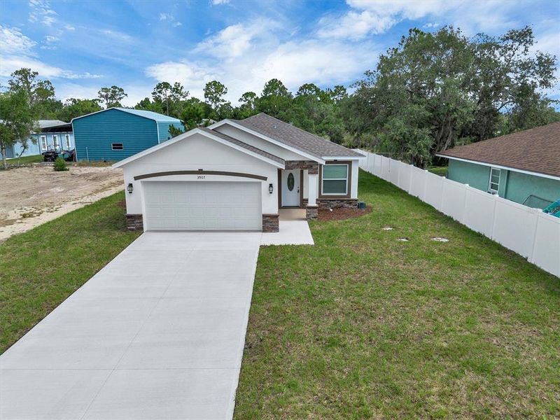 Front exterior of a new home in , Lake Wales, FL, highlighting curb appeal (Image 20). Front exterior of a new home in , Lake Wales, FL, highlighting curb appeal (Image 20).