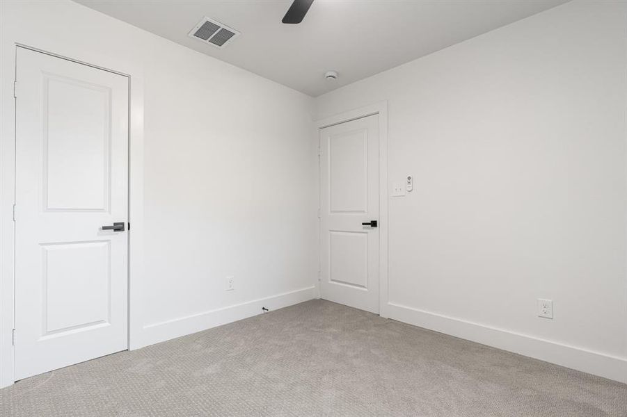 Unfurnished room with carpet floors and ceiling fan