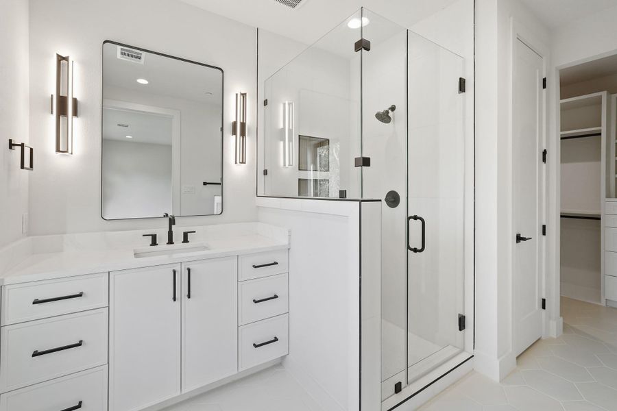 The Bath here also has a shower. WC closet and big walk-in are evident beyond.