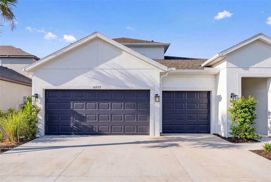 Front exterior of a new home in , Bradenton, FL, highlighting curb appeal (Image 26).