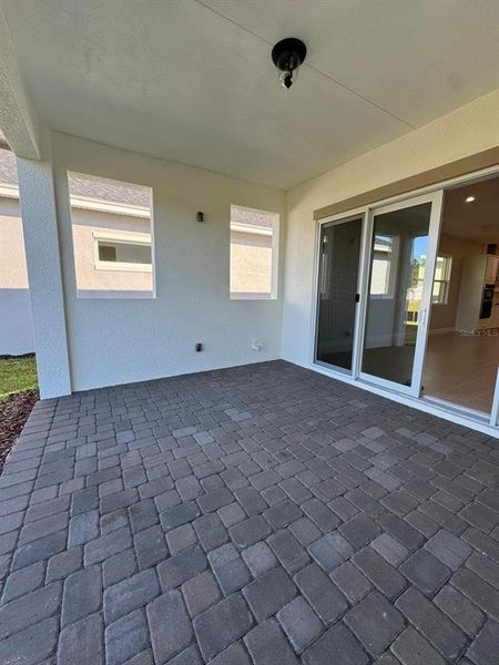 Exterior details and patio area of a home in Ridgehaven, Ormond Beach (Image 3).