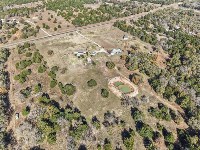 Aerial view of property and surrounding area featuring rural landscape Aerial view of property and surrounding area featuring rural landscape