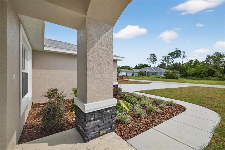Front exterior of a new home in , Spring Hill, FL, highlighting curb appeal (Image 21).