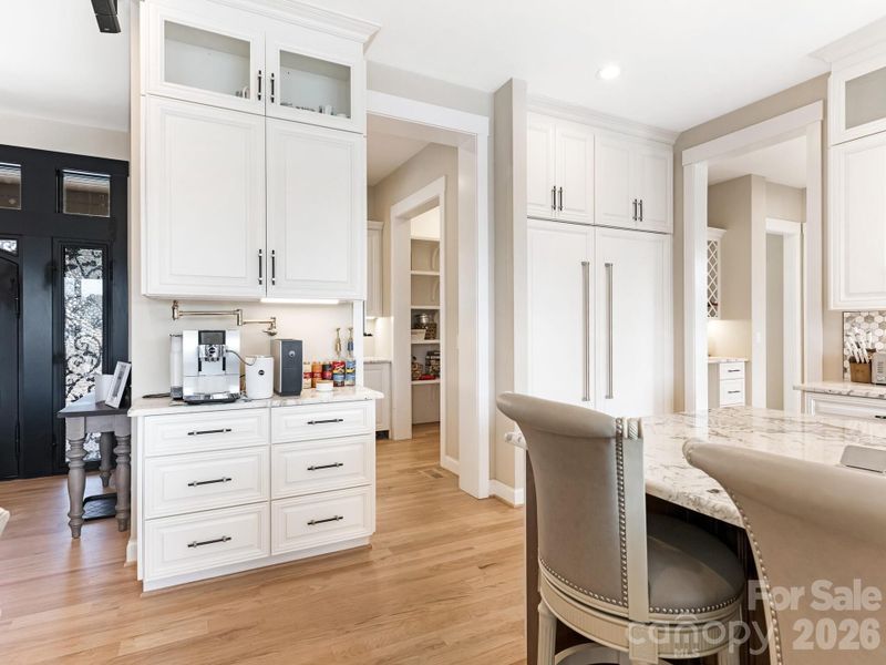 Coffee station on kitchen side of the butler's pantry. Note the water filler for the coffee
