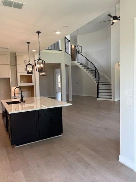 Representative photo of the kitchen and family area. Representative photo of the kitchen and family area.