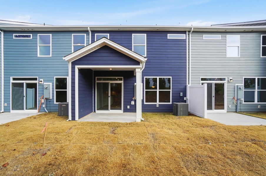 Exterior details and patio area of a home in Harrisburg Village Townhomes, Harrisburg (Image 33).