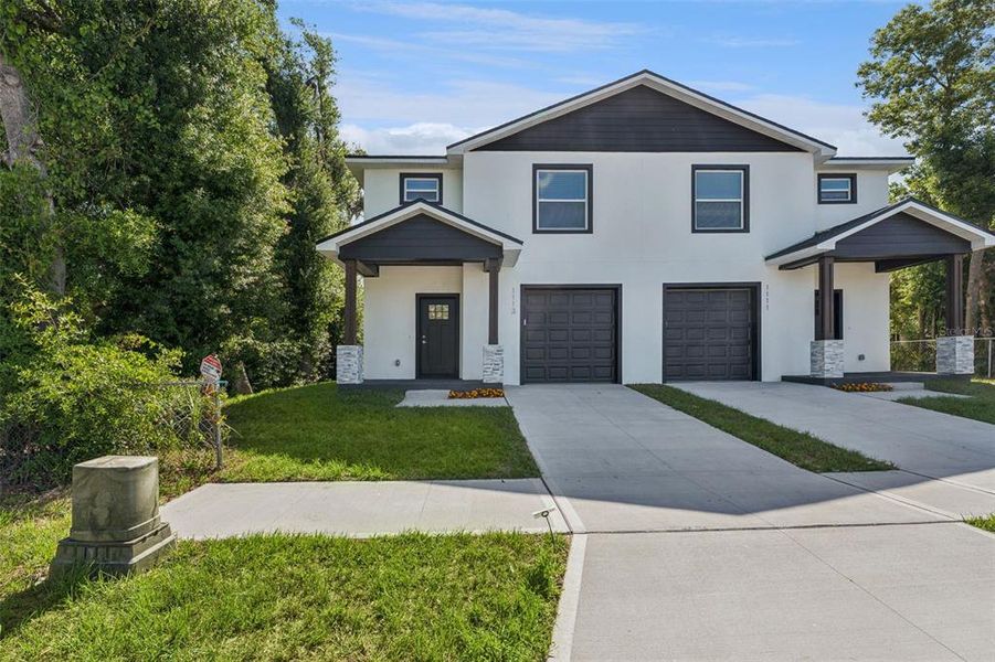 Front exterior of a new home in , Lakeland, FL, highlighting curb appeal (Image 21).