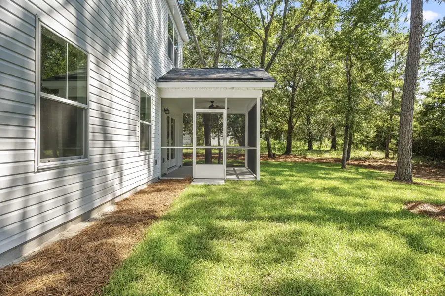 Exterior details and patio area of a home in , Johns Island (Image 18).