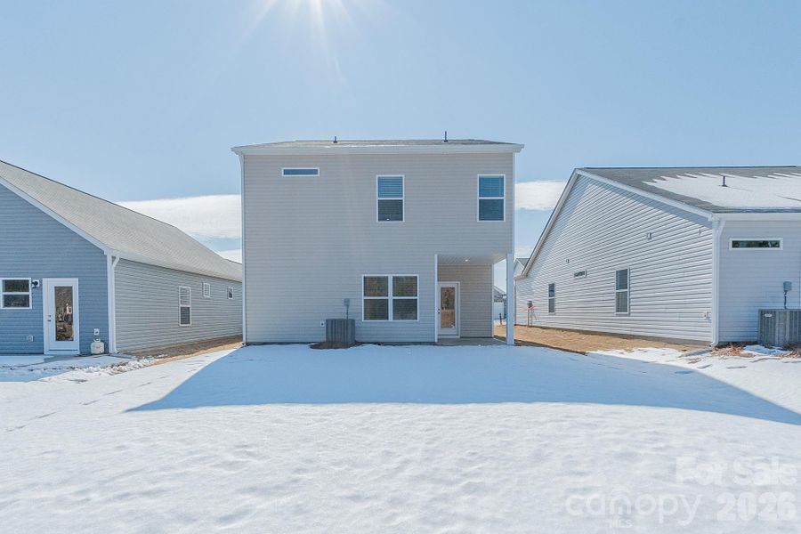 Exterior details and patio area of a home in Country Club Village, Salisbury (Image 3).