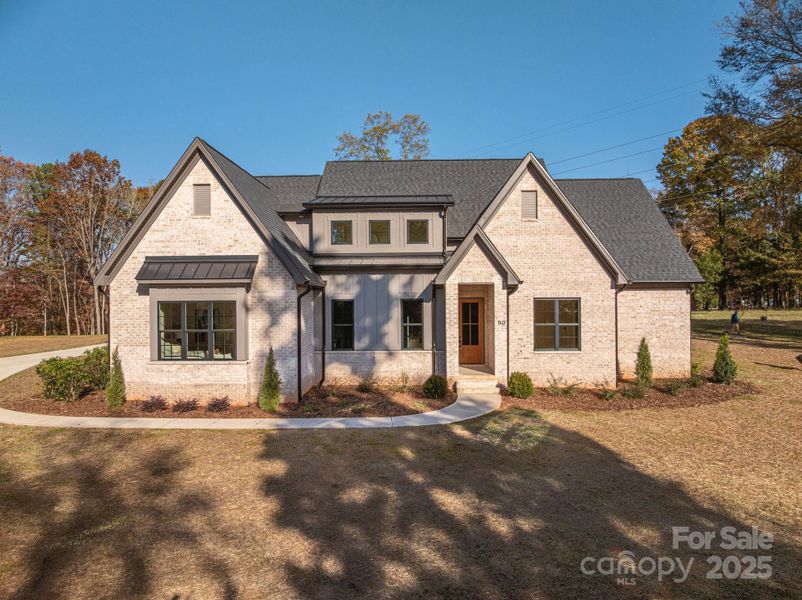 Front exterior of a new home in , Belmont, NC, highlighting curb appeal (Image 1).