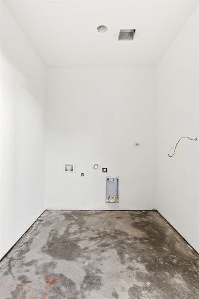 Laundry room with gas dryer hookup, unfinished concrete floors, and washer hookup