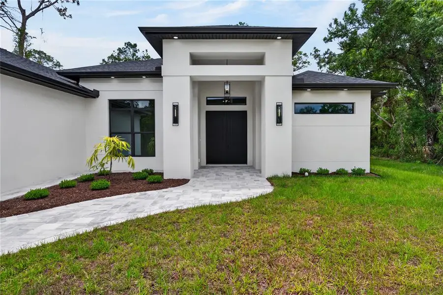 Exterior details and patio area of a home in , North Port (Image 45).