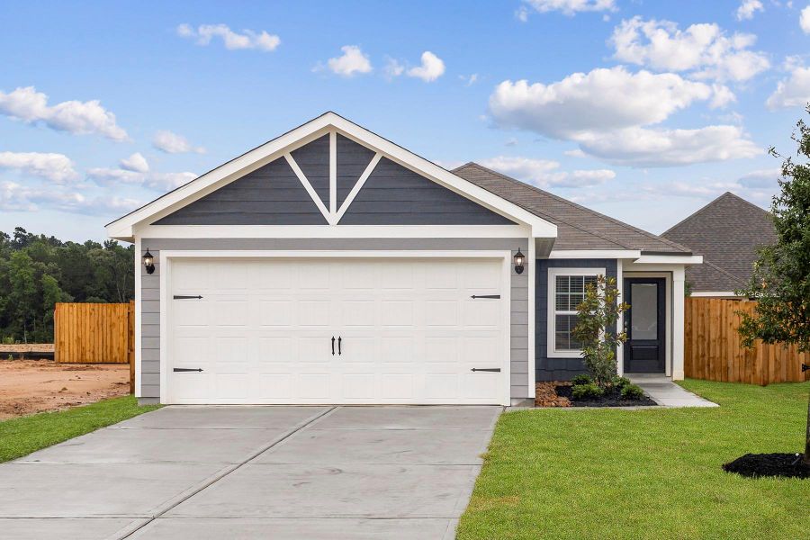 Front exterior of a new home in Magnolia Woods, Magnolia, TX, highlighting curb appeal (Image 2).