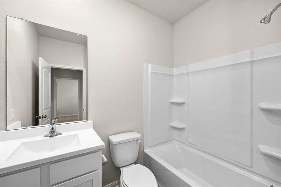 The secondary bathroom is located centrally.