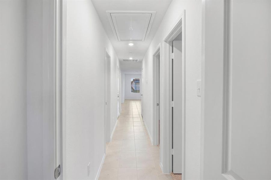 Hall with light tile patterned floors