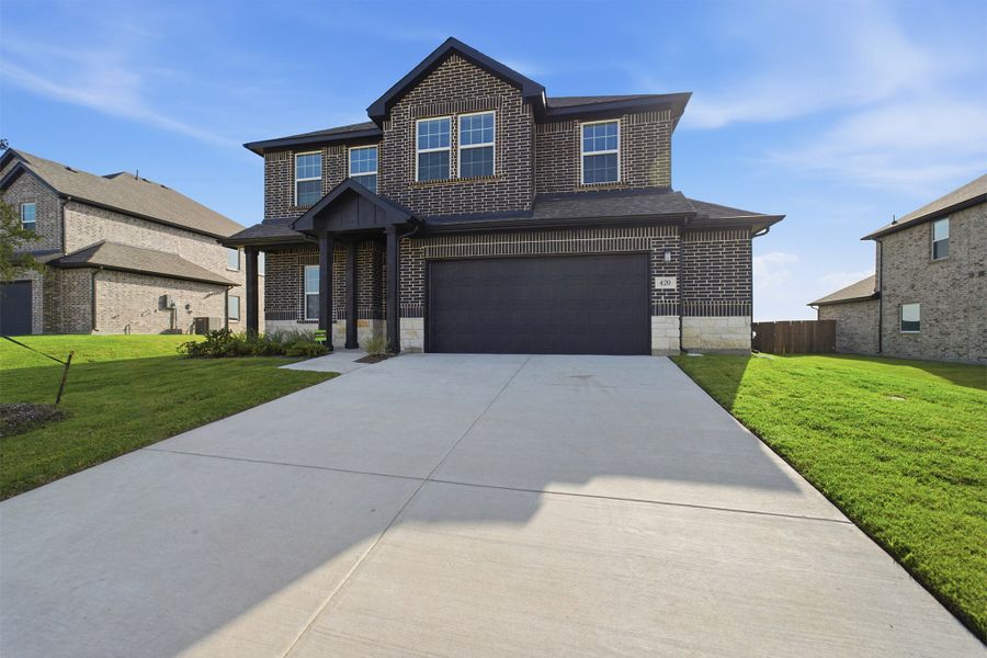 Front exterior of a new home in Saddlebrook Estates, Waxahachie, TX, highlighting curb appeal (Image 2).