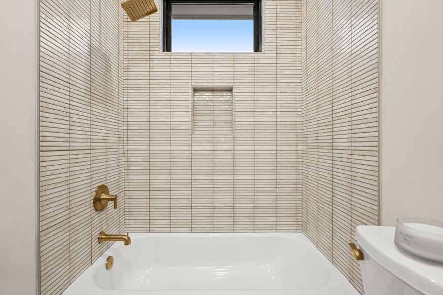 Full bath featuring shower / washtub combination and toilet