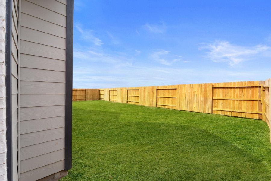 Front exterior of a new home in Brookewater, Rosenberg, TX, highlighting curb appeal (Image 21). Front exterior of a new home in Brookewater, Rosenberg, TX, highlighting curb appeal (Image 21).