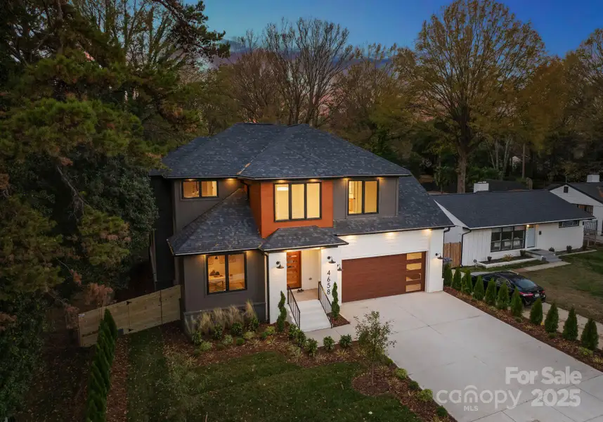 Front exterior of a new home in , Charlotte, NC, highlighting curb appeal (Image 1).