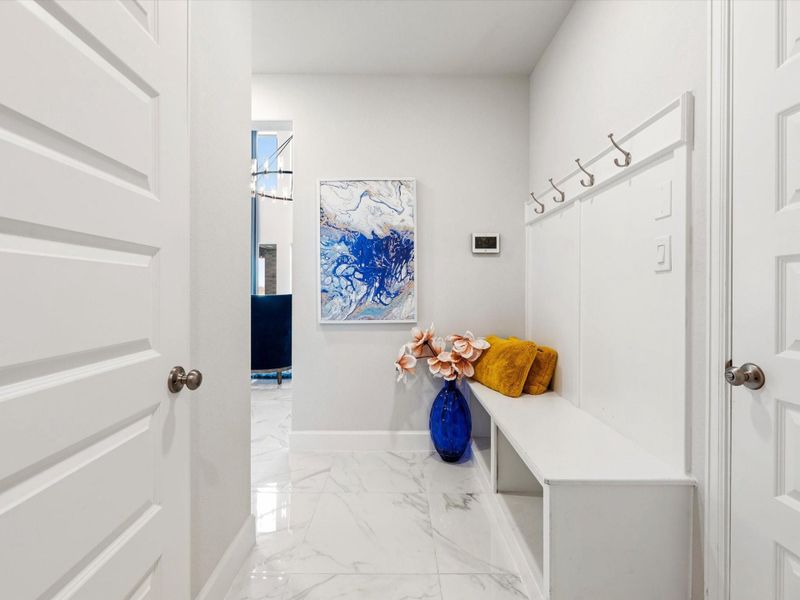 Perfect mud area! Come in from the 3 car garage and change into some comfy house shoes. Hang up that slightly damp coat, backpack or umbrella!