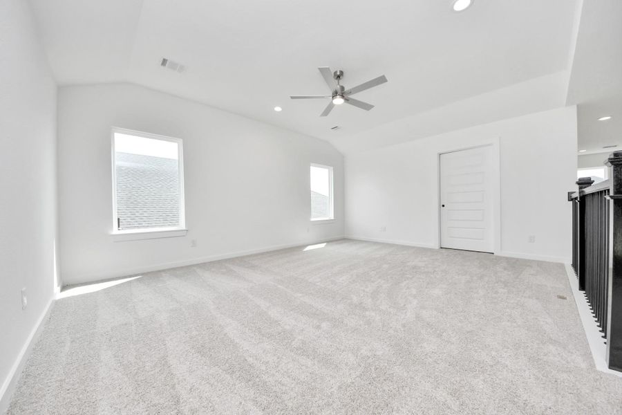Come upstairs and enjoy a day of leisure in this fabulous game room! This is the perfect hangout spot or adult game room! Features plush carpet, high ceilings, custom paint and windows for plenty of natural light. Come upstairs and enjoy a day of leisure in this fabulous game room! This is the perfect hangout spot or adult game room! Features plush carpet, high ceilings, custom paint and windows for plenty of natural light.