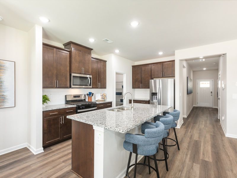 Kitchen in the Chandler floorplan at a Meritage Homes community in Angier, NC.