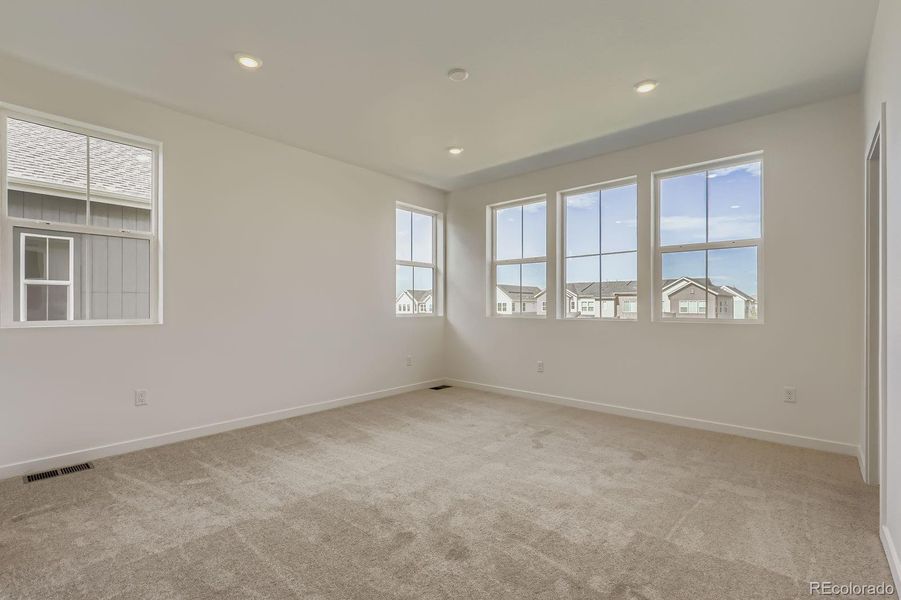 Spacious, unfurnished interior of a new home in Sky Ranch: Parkside Collection, Watkins (Image 11).