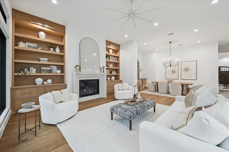 Soft textures and layered neutrals define this inviting gathering space. Generous seating options and unobstructed sightlines reinforce the home’s indoor–outdoor rhythm, supported by the quiet comfort of Trane HVAC and spray foam insulation. *Previous Project*