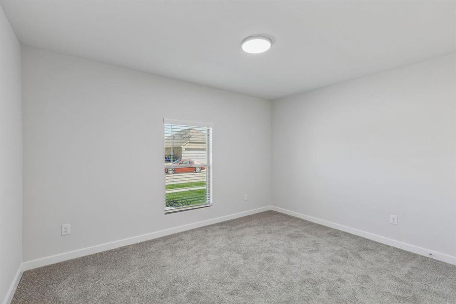 Bedroom in the Harrison home plan by Trophy Signature Homes – REPRESENTATIVE PHOTO