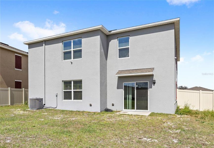 Exterior details and patio area of a home in Eden Hills, Lake Alfred (Image 28).