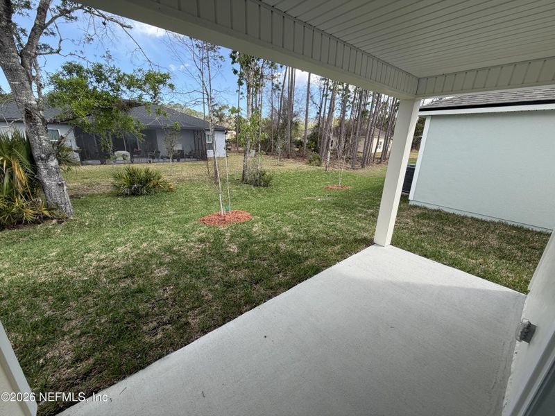 Exterior details and patio area of a home in Grand Reserve, Bunnell (Image 2).