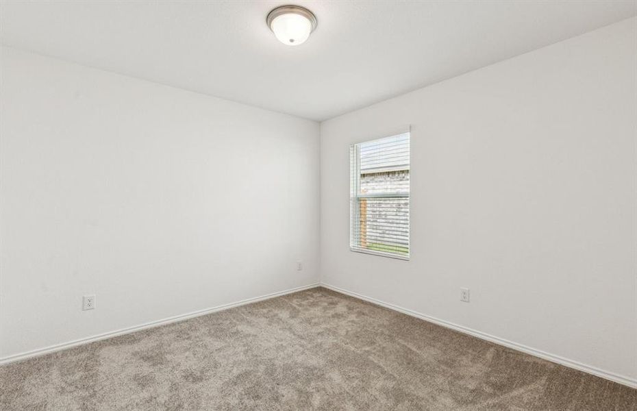 Roomy secondary bedroom with extensive closet storage *Real home pictured Roomy secondary bedroom with extensive closet storage *Real home pictured