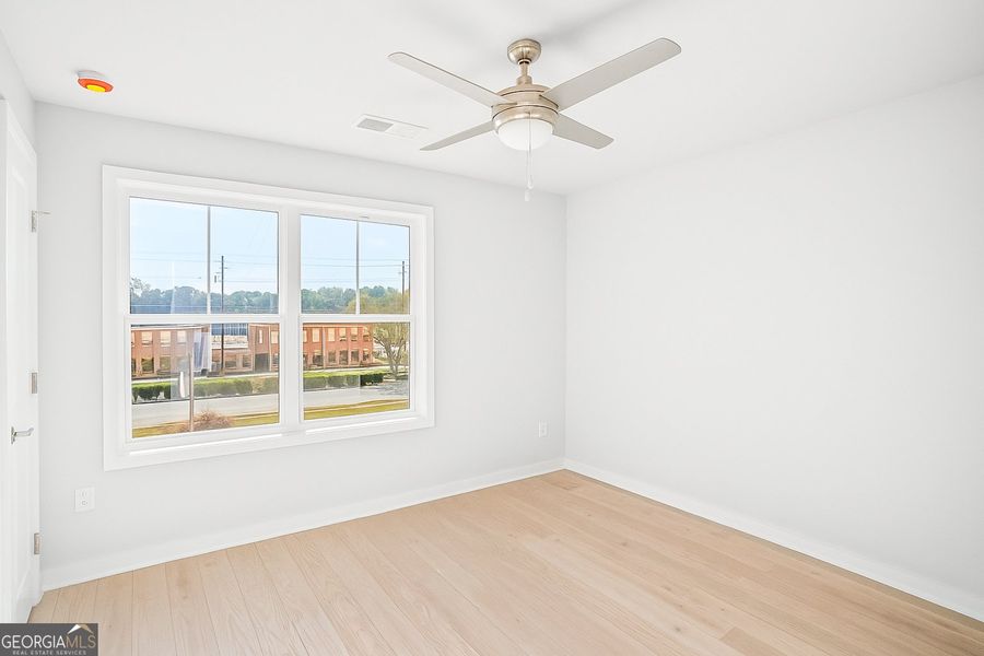Spacious, unfurnished interior of a new home in The Cottages at East Lanier, Fayetteville (Image 9).