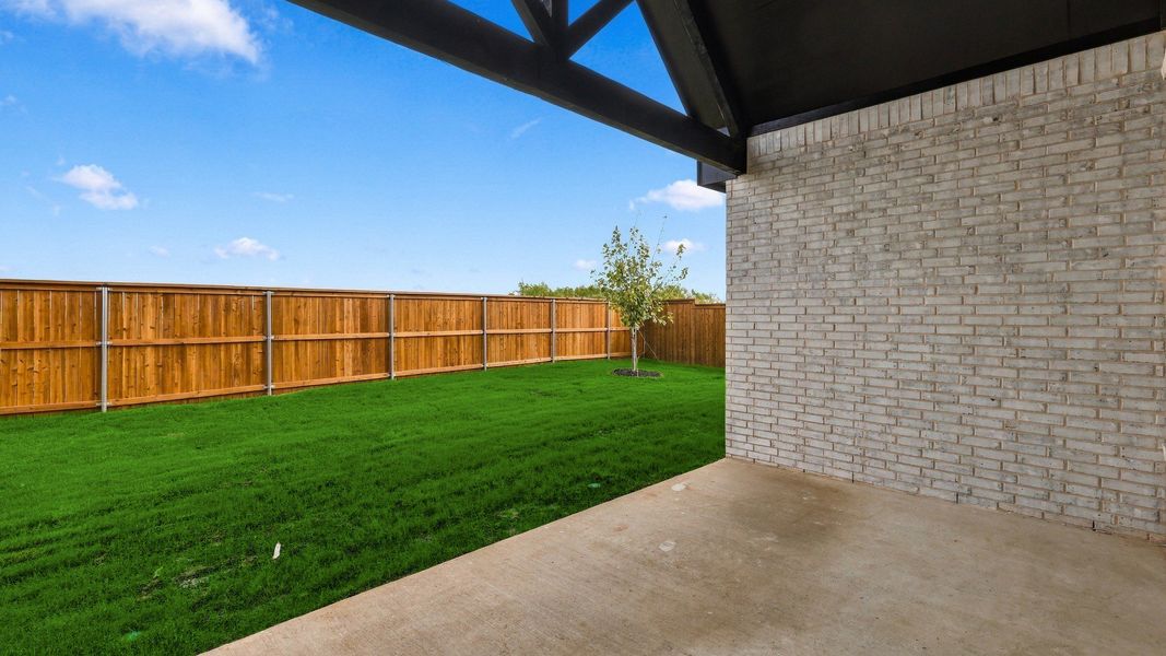 Exterior details and patio area of a home in Green Meadows Classic, Celina (Image 25).