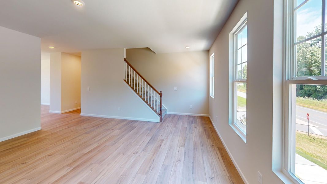 Light filled great room with easy access to the kitchen and dining spaces.