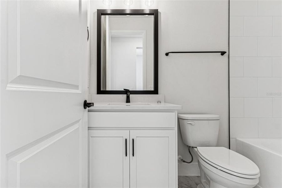 Furnished interior view inside a new home in North River Ranch - Cottage Series, Parrish (Image 17).