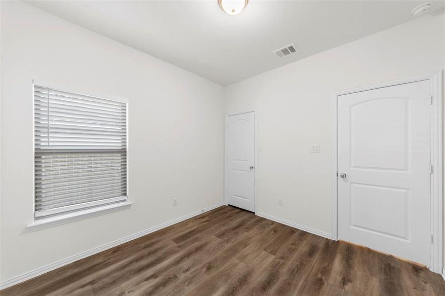 room featuring dark wood-type flooring