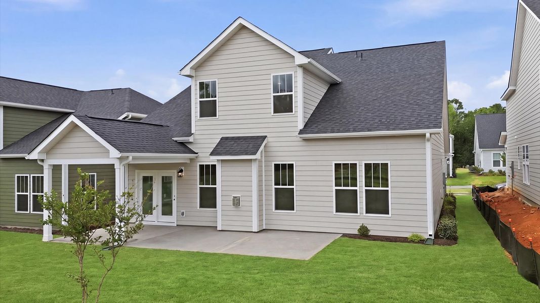 Superior curb appeal continues to the back with a refined, covered outdoor living space at Mulberry Estates