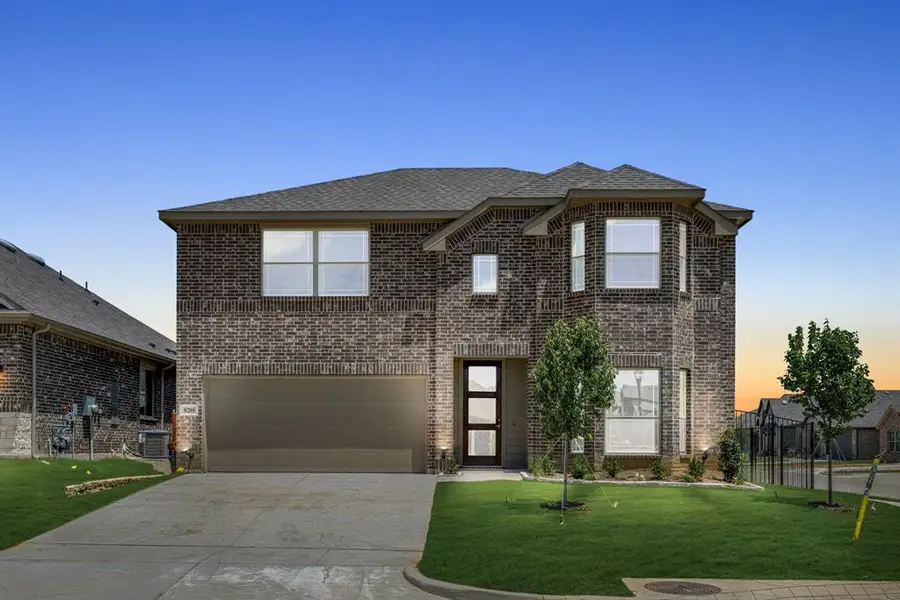 Front exterior of a new home in Godley Ranch Elements, Godley, TX, highlighting curb appeal (Image 2). Front exterior of a new home in Godley Ranch Elements, Godley, TX, highlighting curb appeal (Image 2).