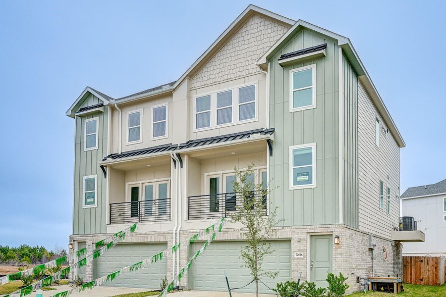 Front exterior of a new home in Townsen Landing, Humble, TX, highlighting curb appeal (Image 2). Front exterior of a new home in Townsen Landing, Humble, TX, highlighting curb appeal (Image 2).