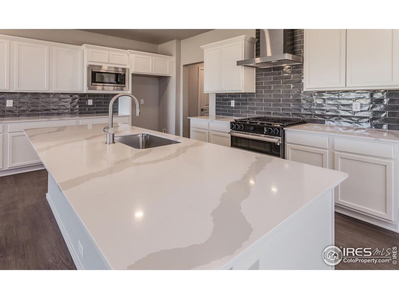Stunning Quartz Countertops and Subway Tile Backsplash!