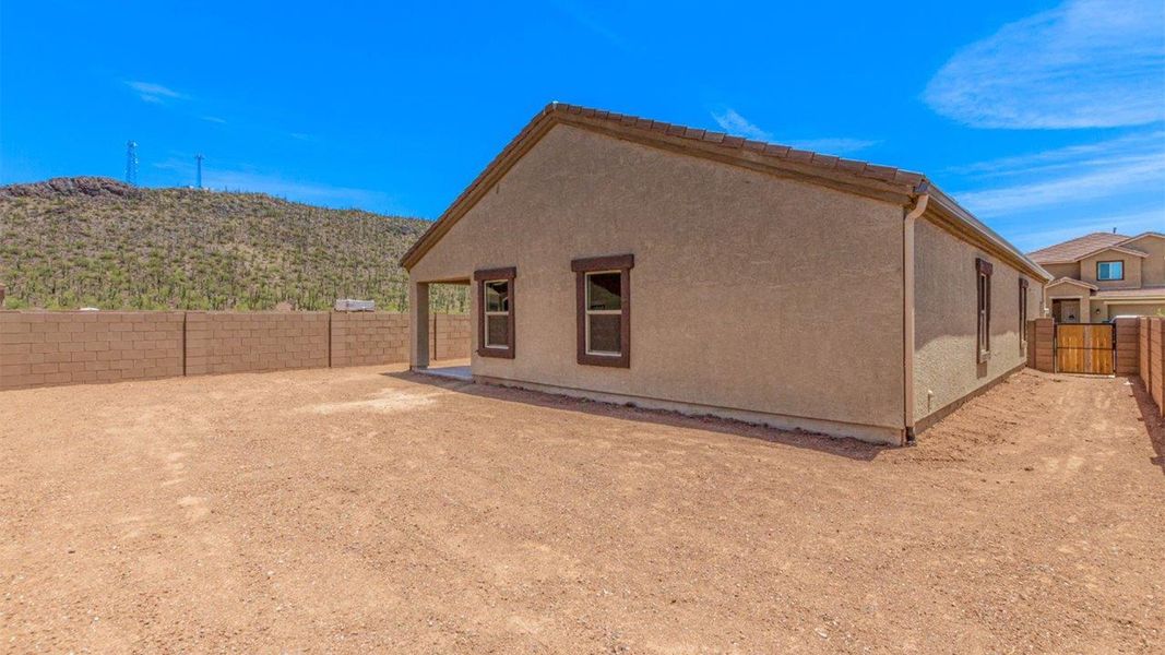 Front exterior of a new home in Sycamore Vista, Vail, AZ, highlighting curb appeal (Image 19).